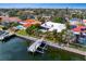 Waterfront home with private dock, screened lanai, and a lush tropical landscape at 1960 Montana Ne Ave, St Petersburg, FL 33703