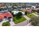 A waterfront home with a private boat dock, a meticulously manicured lawn and lush landscaping at 1960 Montana Ne Ave, St Petersburg, FL 33703