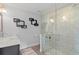 Modern bathroom featuring a glass enclosed shower with designer tile and marble countertop at 1960 Montana Ne Ave, St Petersburg, FL 33703
