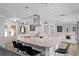 Bright kitchen with marble countertops, a kitchen island with seating, and stainless steel appliances at 1960 Montana Ne Ave, St Petersburg, FL 33703