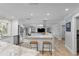 Contemporary kitchen with marble countertops, stainless steel appliances, and view to the back patio and pool at 1960 Montana Ne Ave, St Petersburg, FL 33703