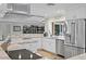 Bright modern kitchen with stainless steel appliances, light countertops, and white cabinets at 1960 Montana Ne Ave, St Petersburg, FL 33703