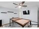 Well-lit living room with a ceiling fan and wall-mounted television at 1960 Montana Ne Ave, St Petersburg, FL 33703