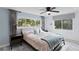 Bright main bedroom featuring large windows, ceiling fan, and neutral color scheme at 1960 Montana Ne Ave, St Petersburg, FL 33703