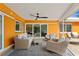 Outdoor patio with comfortable seating and a ceiling fan at 1960 Montana Ne Ave, St Petersburg, FL 33703