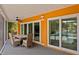Covered outdoor patio with dining table and chairs, perfect for entertaining with views of the pool at 1960 Montana Ne Ave, St Petersburg, FL 33703