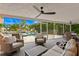 Covered patio featuring ample seating overlooking the pool and spa with tropical landscaping and water views at 1960 Montana Ne Ave, St Petersburg, FL 33703