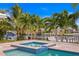 Inviting spa with blue tiles set in a tropical landscape with canal views and easy boat access at 1960 Montana Ne Ave, St Petersburg, FL 33703