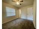 Comfortable carpeted bedroom with a ceiling fan at 206 Circle Hill Dr, Brandon, FL 33510