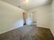This bedroom features a double-door closet and neutral carpet at 206 Circle Hill Dr, Brandon, FL 33510
