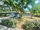 Charming home with mature landscaping, featuring a large front yard at 206 Circle Hill Dr, Brandon, FL 33510