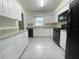 Bright kitchen with white cabinets and modern appliances at 206 Circle Hill Dr, Brandon, FL 33510