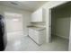 Well-lit kitchen with white cabinetry and granite countertops at 206 Circle Hill Dr, Brandon, FL 33510