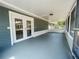 Covered and screened-in patio with painted floor and double doors at 206 Circle Hill Dr, Brandon, FL 33510