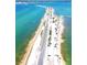 Breathtaking aerial view of Honeymoon Island Causeway, showcasing the stunning coastline and turquoise waters at 230 Portree Dr, Dunedin, FL 34698