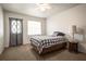 This bedroom has a ceiling fan, bed, and a decorative side table with lamp at 230 Portree Dr, Dunedin, FL 34698
