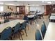 Spacious clubhouse featuring tables and chairs, perfect for community gatherings at 230 Portree Dr, Dunedin, FL 34698