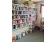 Cozy library filled with extensive bookshelves, offering a quiet space for reading and relaxation at 230 Portree Dr, Dunedin, FL 34698
