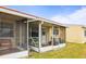 Enclosed screened patio is perfect for outdoor dining and entertaining at 230 Portree Dr, Dunedin, FL 34698