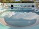 Refreshing outdoor swimming pool for residents to enjoy on sunny days at 230 Portree Dr, Dunedin, FL 34698
