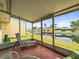 The screened patio boasts serene water views at 230 Portree Dr, Dunedin, FL 34698