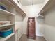 Walk-in closet with shelving and clothing racks with a chest of drawers at 230 Portree Dr, Dunedin, FL 34698