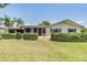 Home exterior featuring a patio and lush landscaping at 2724 Ashwood Ct, Clearwater, FL 33761