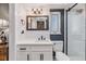 Modern bathroom featuring subway tile, a sleek vanity, and a glass-enclosed shower at 2724 Ashwood Ct, Clearwater, FL 33761
