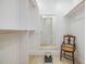 Walk-in closet featuring custom shelving, mirror, vintage chair, and vintage scale at 2724 Ashwood Ct, Clearwater, FL 33761