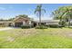Charming single-story home featuring a well-manicured lawn and two-car attached garage at 2724 Ashwood Ct, Clearwater, FL 33761