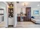 Stylish kitchen featuring two-tone cabinets, a beverage fridge, and sleek hardware at 2724 Ashwood Ct, Clearwater, FL 33761