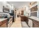 Modern kitchen with stainless steel appliances, granite countertops, and ample cabinet space at 2724 Ashwood Ct, Clearwater, FL 33761