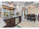 Well-designed kitchen with stainless steel appliances, granite countertops, and views of the dining area at 2724 Ashwood Ct, Clearwater, FL 33761