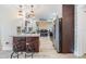 Beautiful kitchen with granite countertops, stainless steel appliances, a breakfast bar with seating, and adjacent dining area at 2724 Ashwood Ct, Clearwater, FL 33761