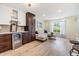 Open-concept living area featuring a built-in beverage fridge, and comfortable seating perfect for entertaining guests at 2724 Ashwood Ct, Clearwater, FL 33761