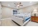 Tranquil main bedroom with a nautical theme, a comfortable bed, and a view of the outdoors at 2724 Ashwood Ct, Clearwater, FL 33761