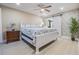 Serene main bedroom featuring a decorative brick wall and a stylish sliding barn door at 2724 Ashwood Ct, Clearwater, FL 33761