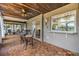 Covered patio featuring wood ceiling, fan, wood tile flooring and bar seating at 2724 Ashwood Ct, Clearwater, FL 33761