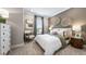Well-lit bedroom with soft carpeting, neutral walls, and decorative furnishings at 29524 Zupetta Ln, Wesley Chapel, FL 33543
