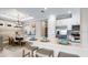 Open-concept kitchen with stainless steel appliances, quartz countertops, and modern fixtures at 29524 Zupetta Ln, Wesley Chapel, FL 33543