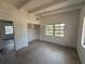 Bedroom boasts a built-in closet, large windows, and a neutral color scheme at 3000 58Th S Ave, St Petersburg, FL 33712