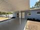 Carport view from an angle showing dual entry doors and providing ample covered parking at 3000 58Th S Ave, St Petersburg, FL 33712