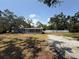 Charming single-story home featuring a screened porch, surrounded by mature trees and a spacious yard at 3000 58Th S Ave, St Petersburg, FL 33712