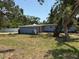 Charming one-story light blue home with a well-manicured lawn and simple landscaping in a serene neighborhood at 3000 58Th S Ave, St Petersburg, FL 33712