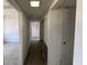 Long hallway with doors leading to various rooms in the home at 3000 58Th S Ave, St Petersburg, FL 33712