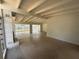 Bright living room featuring high ceilings, exposed beams, and a painted brick fireplace at 3000 58Th S Ave, St Petersburg, FL 33712