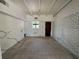 Unfurnished living room with white brick wall and exposed beam ceiling at 3000 58Th S Ave, St Petersburg, FL 33712