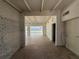 Open living room with white brick wall and exposed beam ceilings at 3000 58Th S Ave, St Petersburg, FL 33712