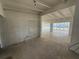 Open living room with white brick accent wall and view of the backyard at 3000 58Th S Ave, St Petersburg, FL 33712