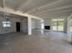 Bright living room with large windows, fireplace, and exposed beam ceiling at 3000 58Th S Ave, St Petersburg, FL 33712